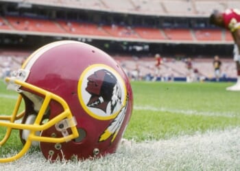 A Washington Redskins helmet lies on the field Nov. 21, 1993, during a game against the Los Angeles Rams at Anaheim Stadium in Anaheim, California. The Rams won the game, 10-6.