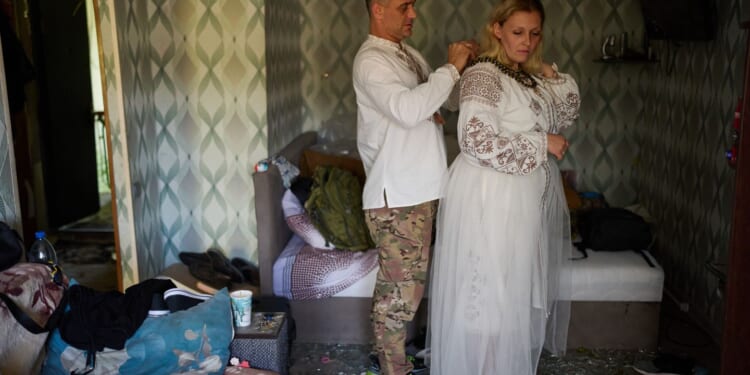 A Ukrainian soldier and his bride dodge Russian bombs to wed in Kyiv