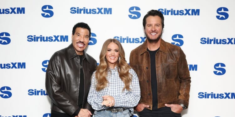 "American Idol" judges Lionel Richie, Carrie Underwood, and Luke Bryan visit SiriusXM's front row event at SiriusXM Studios on March 24, 2026, in New York City.