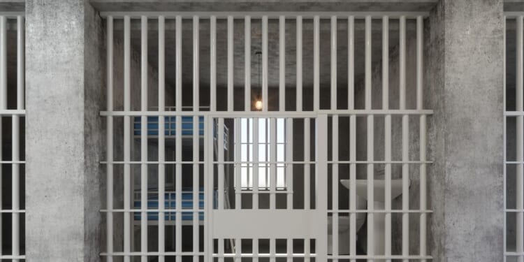 An empty jail cell.