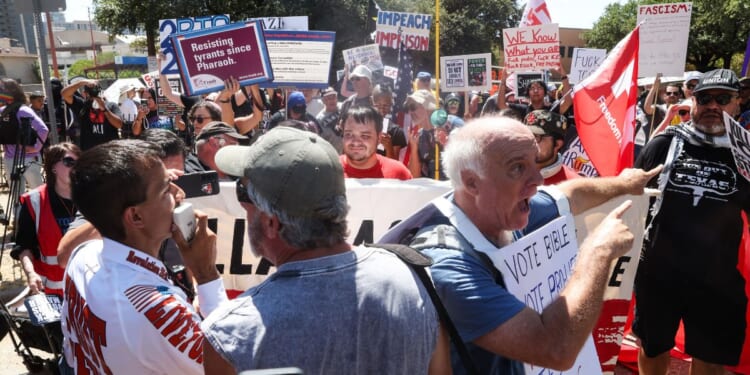 Supporters of President Donald Trump try to interrupt a march by anti-Trump protestors outside the Republican National Committee midterm convention near the American Airlines Center in Dallas, Texas, on Sept. 10, 2026.