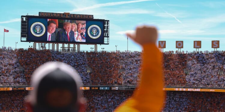 President Donald Trump, Sen. Bill Hagerty, and Sen. Marsha Blackburn appear on a video screen while attending the Texas-Tennessee football game at Neyland Stadium on Sept. 26, 2026, in Knoxville, Tennessee.