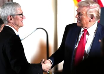 President Donald Trump greets Apple CEO Tim Cook during an October 2025 meeting in Tokyo, Japan.