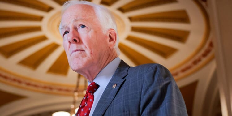 GOP Sen. John Cornyn of Texas speaks with a reporter March 23 in the U.S. Capitol in Washington, D.C.