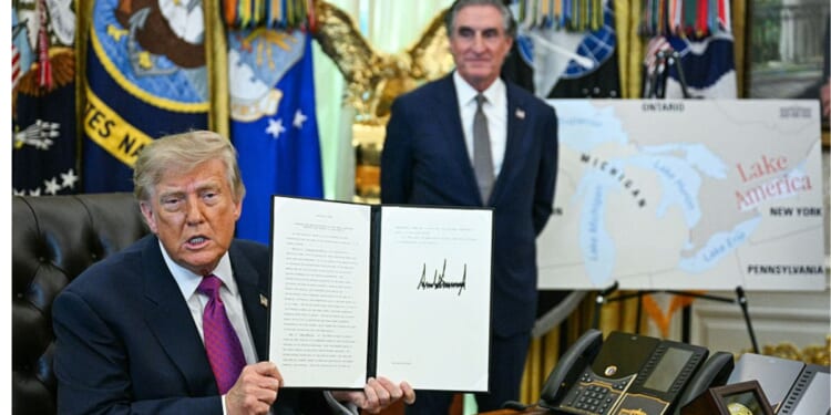 President Donald Trump, seen in an Aug. 27 photo with Secretary of the Interior Doug Burgum, displays an executive order he signed that day, changing the name of Lake Ontario to Lake America.