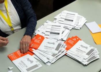 Ballots discounted for late postmarks surged in Washington and Oregon after Postal Service changes