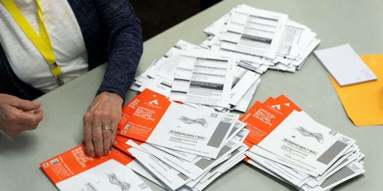 Ballots discounted for late postmarks surged in Washington and Oregon after Postal Service changes