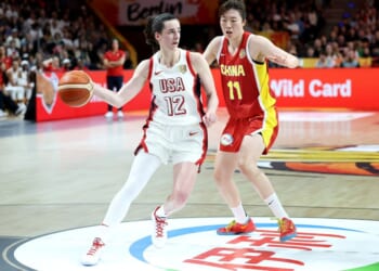 Caitlin Clark of USA dribbles under pressure from Xinyu Luo of China during the FIBA Women's Basketball World Cup Germany 2026 match between USA and China Friday in Berlin, Germany.