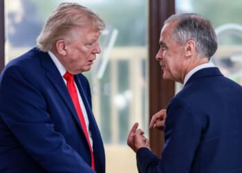 President Donald Trump speaks with Canadian Prime Minister Mark Carney during a work lunch as part of the G7 summit, in Evian, eastern France, on June 16, 2026.