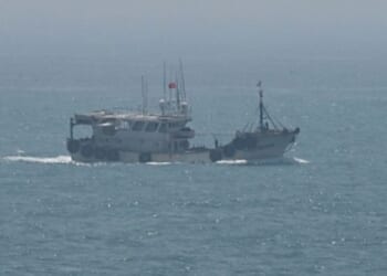 A fishing boat sails across the Taiwanese Strait off the coast of Pingtan Island on April 16, 2023.
