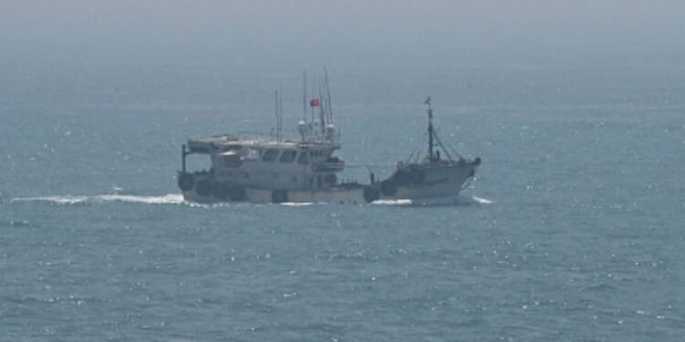 A fishing boat sails across the Taiwanese Strait off the coast of Pingtan Island on April 16, 2023.