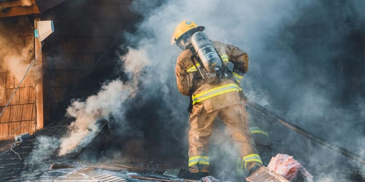 During a fire in Saint-Hugues, Quebec, on the evening of April 25, 2004, firefighters from the municipality as well as neighboring municipalities are battling the blaze.