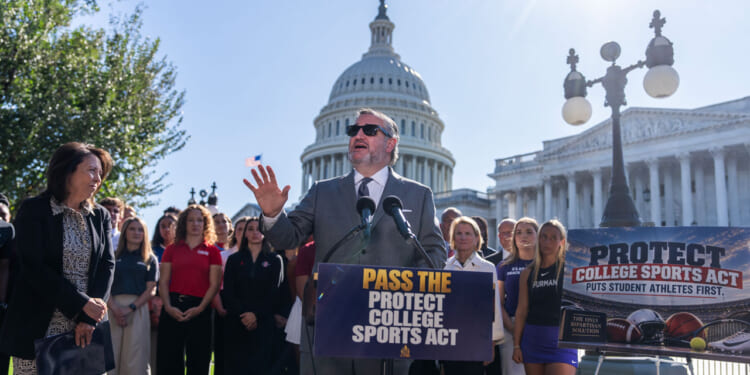 Sen. Ted Cruz speaks at a podium reading Pass the Protect College Sports Act outside the U.S. Capitol, surrounded by supporters, with a sign reading Protect College Sports Act to the right.