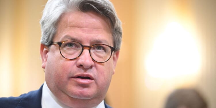 Gabe Sterling, Director of Special Projects for Secretary of State Brad Raffensperger, appears with glasses, wearing a dark suit and tie. He speaks indoors with a blurred background and bright lighting.