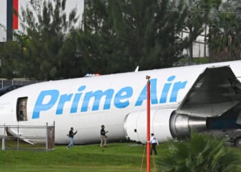 Officials investigate a recently crashed Amazon cargo plane at Miami International Airport on Sept. 6, 2026 in Miami, Florida.