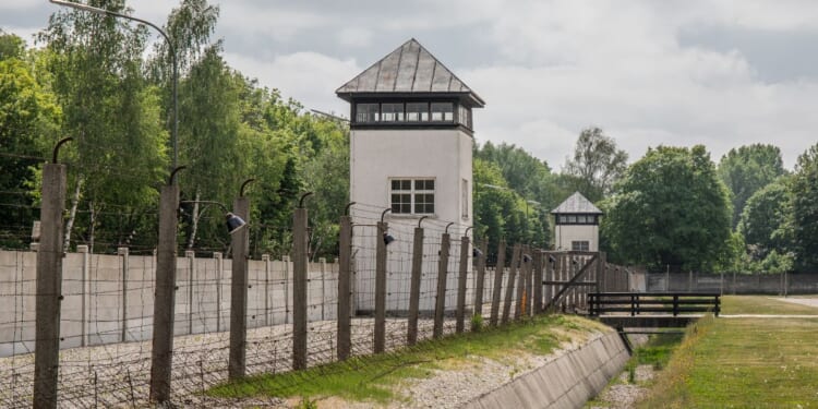 Dachau was fenced and guarded by SS guards. An escape was impossible.