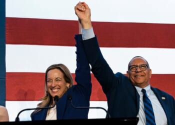 New Jersey Democratic Gov. Mikie Sherrill celebrates with Lt. Gov. Dale Caldwell after their win during an election night watch party at the Hilton East Brunswick Hotel on Nov. 4, 2025, in East Brunswick, New Jersey.