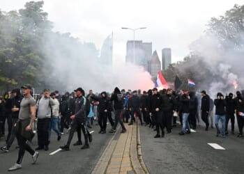 Dutch riot police break up far-right protest in The Hague after violence erupts
