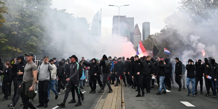 Dutch riot police break up far-right protest in The Hague after violence erupts