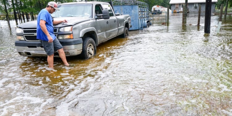 Edouard, now a tropical depression, drenches Texas with flash flooding and downed trees