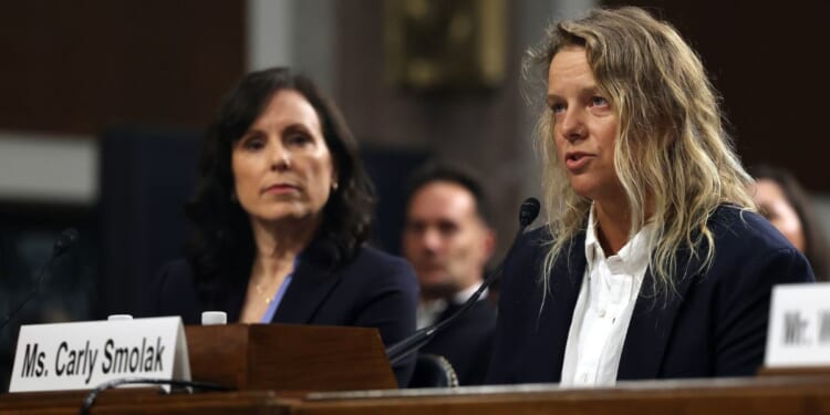 Carly Smolak, right, former goalkeeper for the San Diego Spirit women’s professional soccer team, and Kim Jones, left, co-founder of the The Independent Council on Women's Sport (ICONS), testify Wednesday before the Senate Judiciary Committee in Washington, D.C.