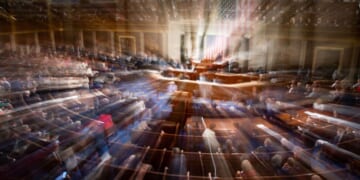 In a slow-shutter exposure, members of Congress congregate on the floor of the House Chamber of the U.S. Capitol Building in Washington, D.C., in a 2023 file photo.