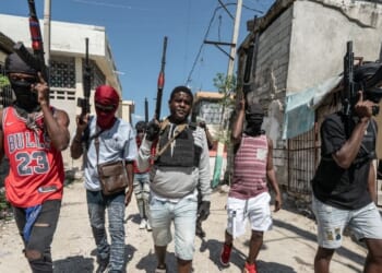 Gang leader Jimmy "Barbecue" Cherizier patrolling the streets with G-9 federation gang members in the Delmas 3 area on Feb. 22, 2024, in Port-au-Prince, Haiti.