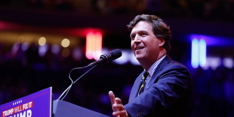 Tucker Carlson speaks before President Donald Trump takes the stage at the campaign rally at Madison Square Garden on Oct. 27, 2024, in New York City.