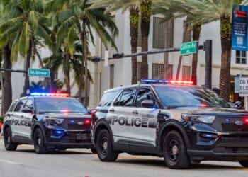 Police vehicles answer a 911 call.
