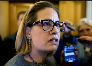 Then-Sen. Kyrsten Sinema of Arizona is seen in a 2024 photo speaking to reporters at the U.S. Capitol Building in Washington, D.C.