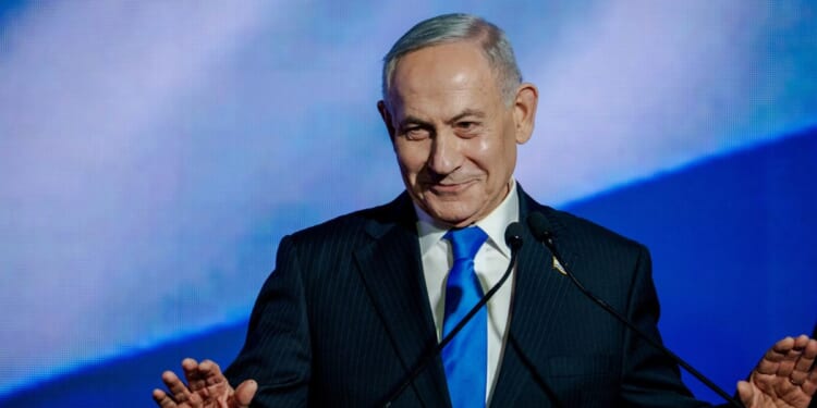 Israeli Prime Minister and Likud party leader Benjamin Netanyahu speaks to supporters at the lectern during a party campaign rally at Expo Tel Aviv on Sept. 17, 2026, in Tel Aviv, Israel.