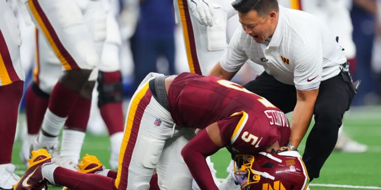 Jayden Daniels suffers dislocated elbow vs. Cowboys: What we know about the injury and timeline