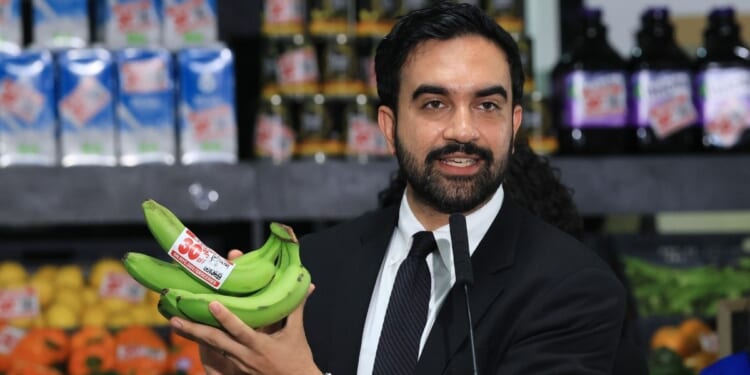 New York City Mayor Zohran Mamdani holds up bananas as he speaks at a food distribution center on July 27, 2026, in the Brooklyn borough of New York City.