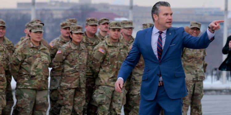 Secretary of War Pete Hegseth address a group of National Guard troops in a file photo from February.