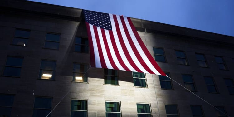 An American flag is unfurled on the side of the Pentagon to mark the 25th anniversary of 9/11 on Sept. 11, 2026, in Arlington, Virginia.