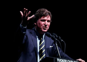 Tucker Carlson speaks at his Live Tour at the Desert Diamond Arena on Oct. 31, 2024, in Phoenix, Arizona.