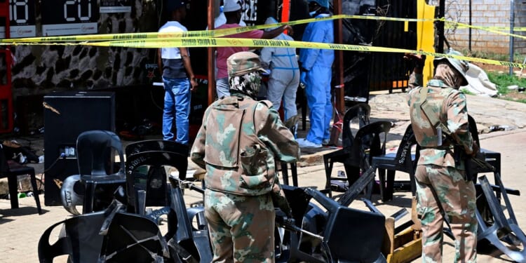 Police hunt gunmen after 2 mass shootings in South Africa leave at least 27 dead