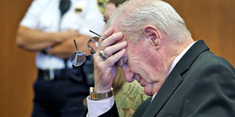 Kevin Reddington, the defense attorney for Lindsay Clancy, holds his head in his hand at Plymouth County Superior Court in Plymouth, Massachusetts, on Sept. 4, 2026.