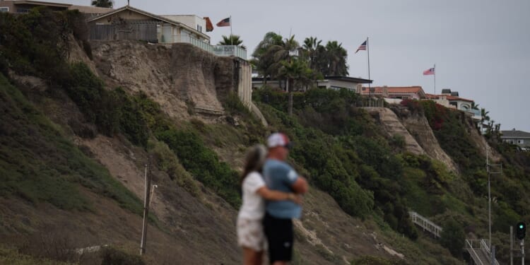 Sea level rise is reshaping a California beach town and threatening a key rail line