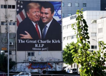 A billboard hangs on a building in Tel Aviv, Israel, showing an image of President Donald Trump embracing conservative icon Charlie Kirk, who was assassinated Sept. 10, 2025. The banner went up on the building shortly after Kirk's death.