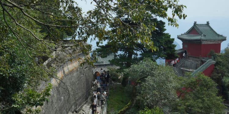 Some climb for faith, others for the views. This Chinese sacred mountain draws them all