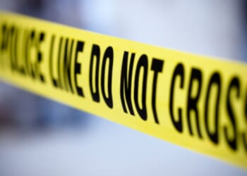 Yellow police tape is pictured.
