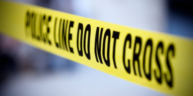 Yellow police tape is pictured.
