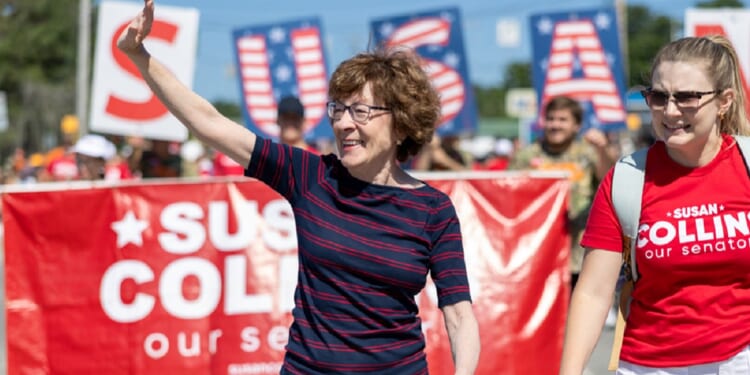Republican Sen. Susan Collins of Maine marches in a "Moxie Day" parade July 11 in Lisbon, Maine.