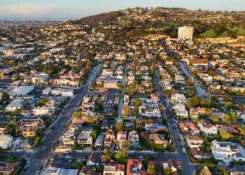 In an aerial view, luxury single-family homes and residential neighborhoods are seen along the coastal community of La Jolla on Aug. 28, 2026, in San Diego, California.