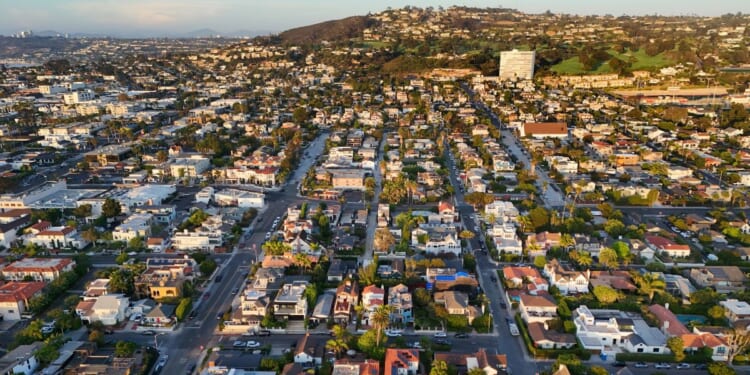 In an aerial view, luxury single-family homes and residential neighborhoods are seen along the coastal community of La Jolla on Aug. 28, 2026, in San Diego, California.