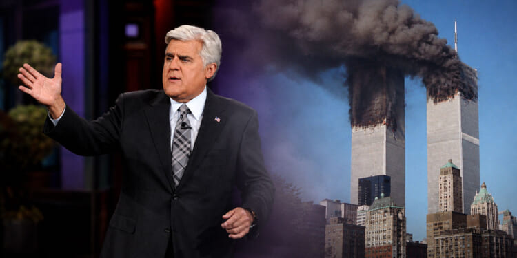 Jay Leno in a suit gestures while speaking, with the burning Twin Towers of the World Trade Center in the background under a blue sky on 9/11.