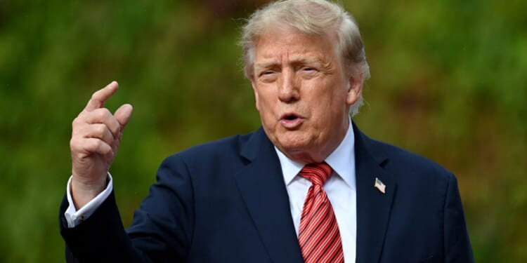 President Donald Trump, seen in a Sept. 12 photo, said the proposed deal would benefit farmers and ranchers.