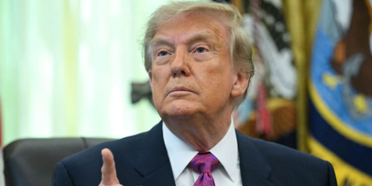 President Donald Trump speaks after signing an executive order that aims to rename Lake Ontario to Lake America in the Oval Office of the White House in Washington, D.C., on Aug. 27, 2026.