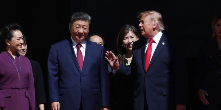 President of China Xi Jinping, First Lady of China Peng Liyuan, President Donald Trump and First Lady Melania Trump walk together outside the National Archives Museum in Washington on Sept. 25, 2026.
